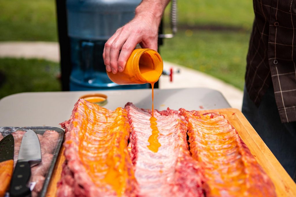 Baby Back Ribs Coated with Meat Glue Breaking in the Meadow Creek BX25 Box Smoker
