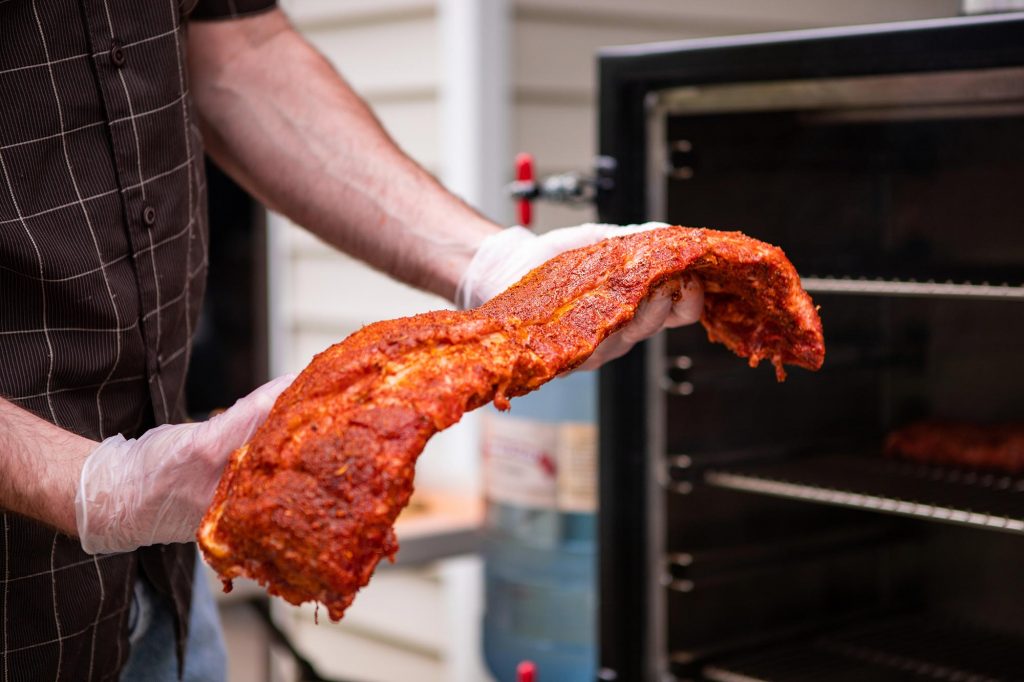 Seasoned Baby Back Ribs Breaking in the Meadow Creek BX25 Box Smoker