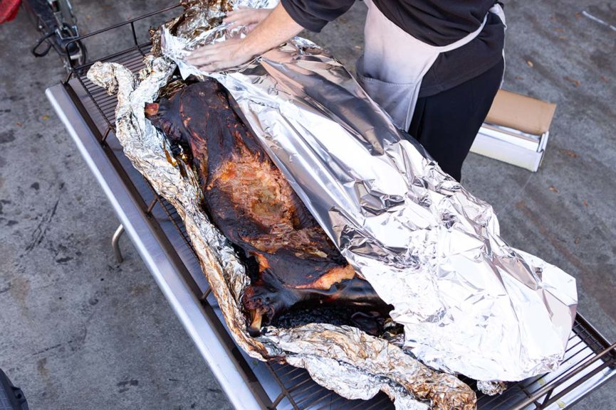 Wrapping Grilled Whole Pig for Rest Wrapping Grilled Whole Pig for Rest