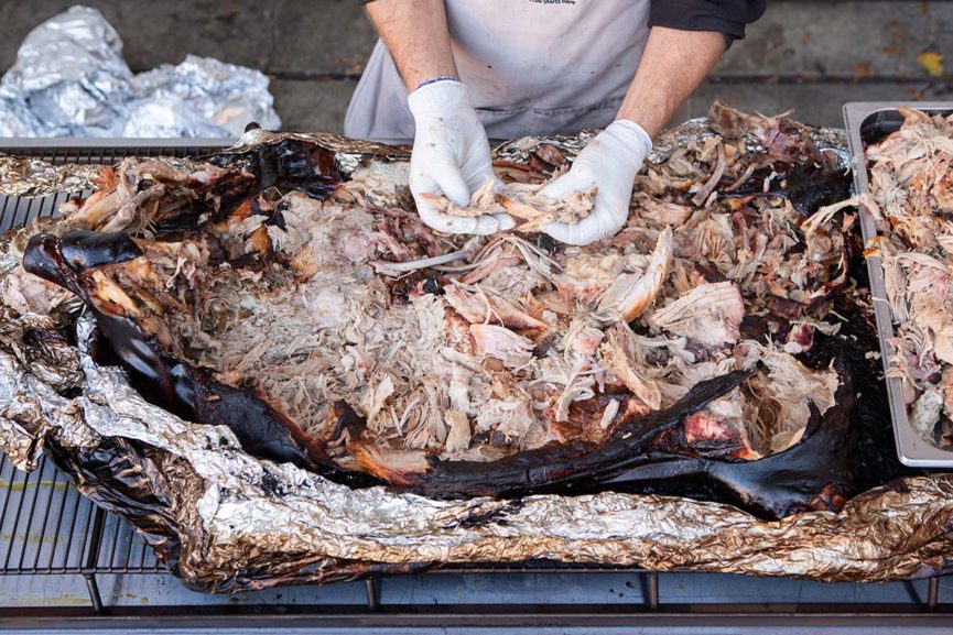 Pulling a Whole Roasted Pig Pulling a Whole Roasted Pig
