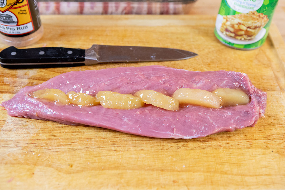 Arrange apples in the pocket Bacon-Wrapped Apple-Stuffed Tenderloin on the Big Green Egg