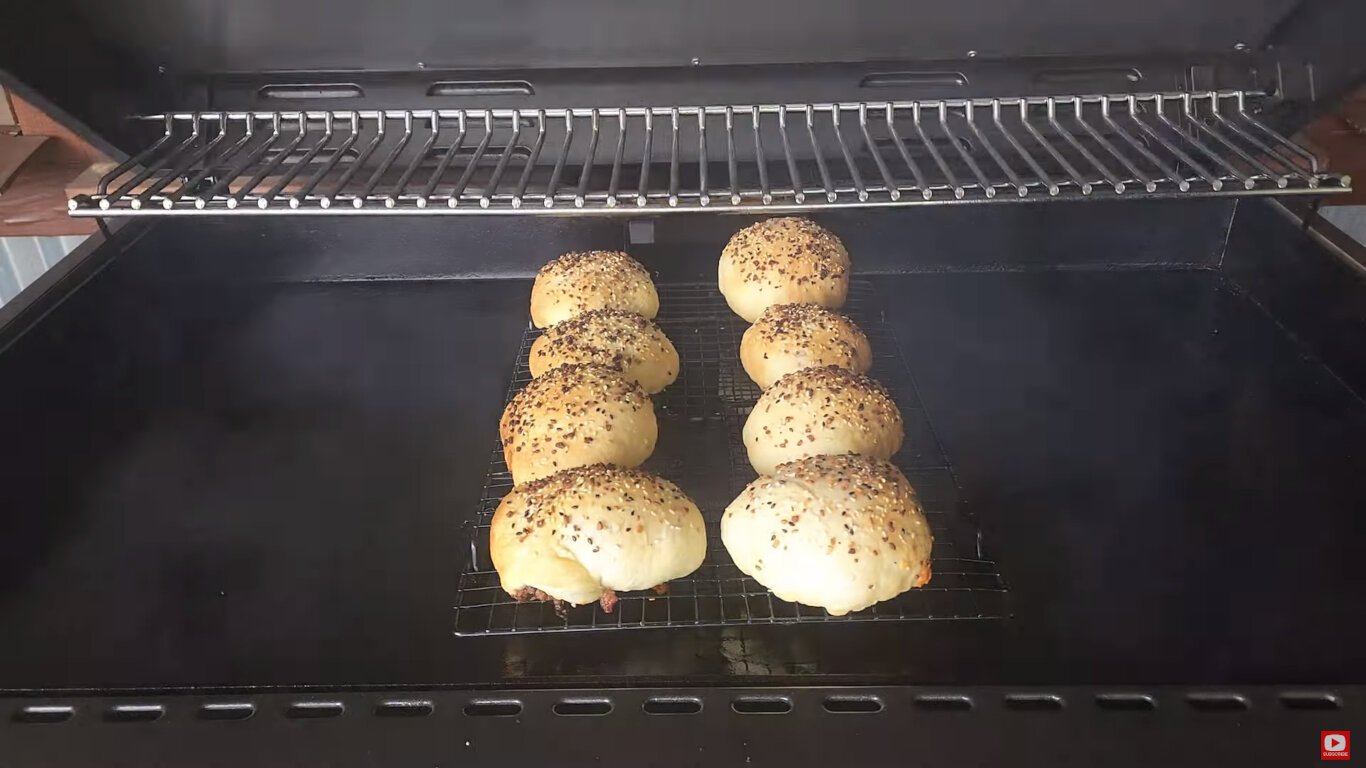 Browned bacon burger bombs on the griddle